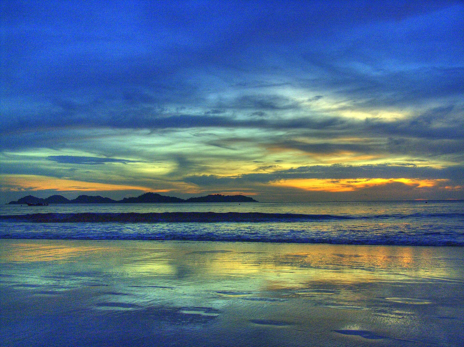 A colourful sunset over the sea in the Trang islands